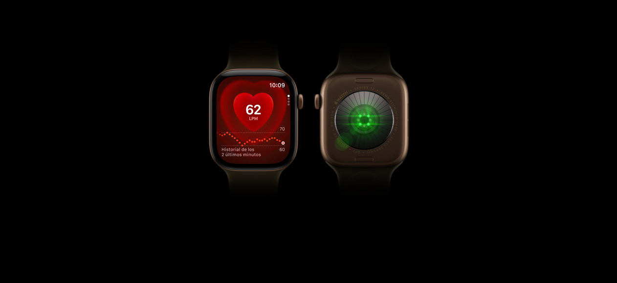 Dos Apple Watch Series 12, caja de aluminio, color bronce oscuro, correa deportiva verde oliva, uno muestra la parte delantera del reloj con la app Frecuencia Cardiaca, el otro muestra la parte trasera del reloj con el sistema de medición de salud con luces LED verdes brillantes