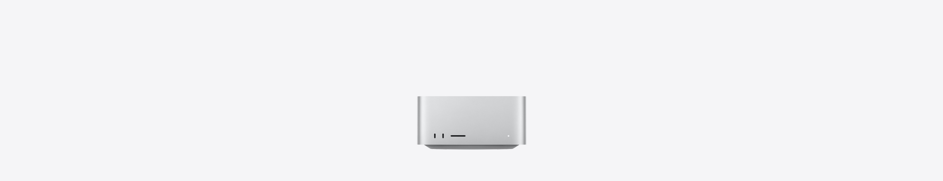 Mac Studioの前面、2つのUSB-Cポート、SDXCカードスロット、ステータスインジケータランプ、逆台形の形状をしたベース部、平らな上部、丸みを帯びた側面、直線的なエッジ、カラーはシルバー