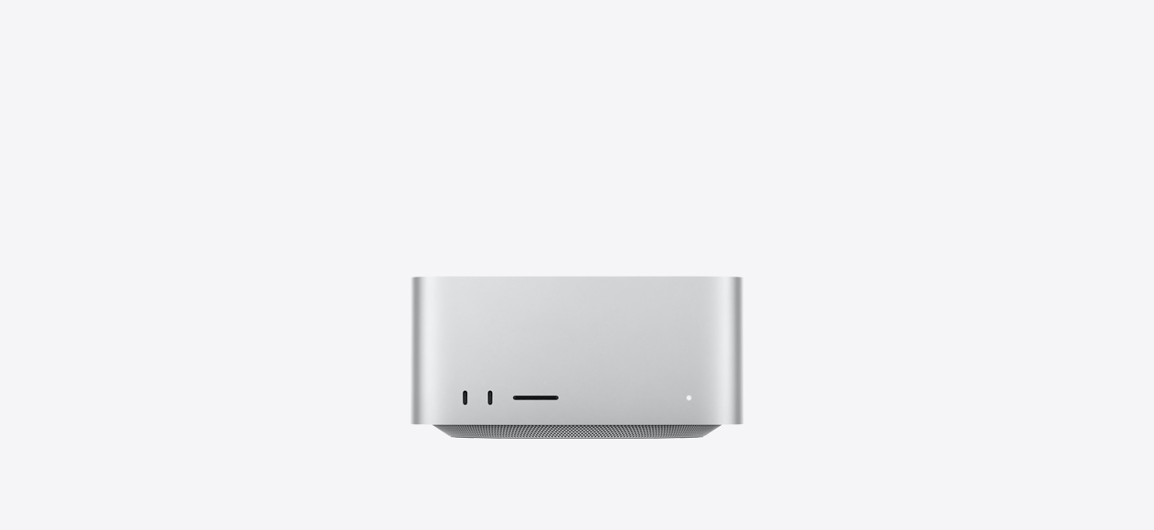 Mac Studio, front, two USB-C ports, SDXC card slot, status indicator light, tapered base at bottom, flat top, rounded sides, straight edges, silver color